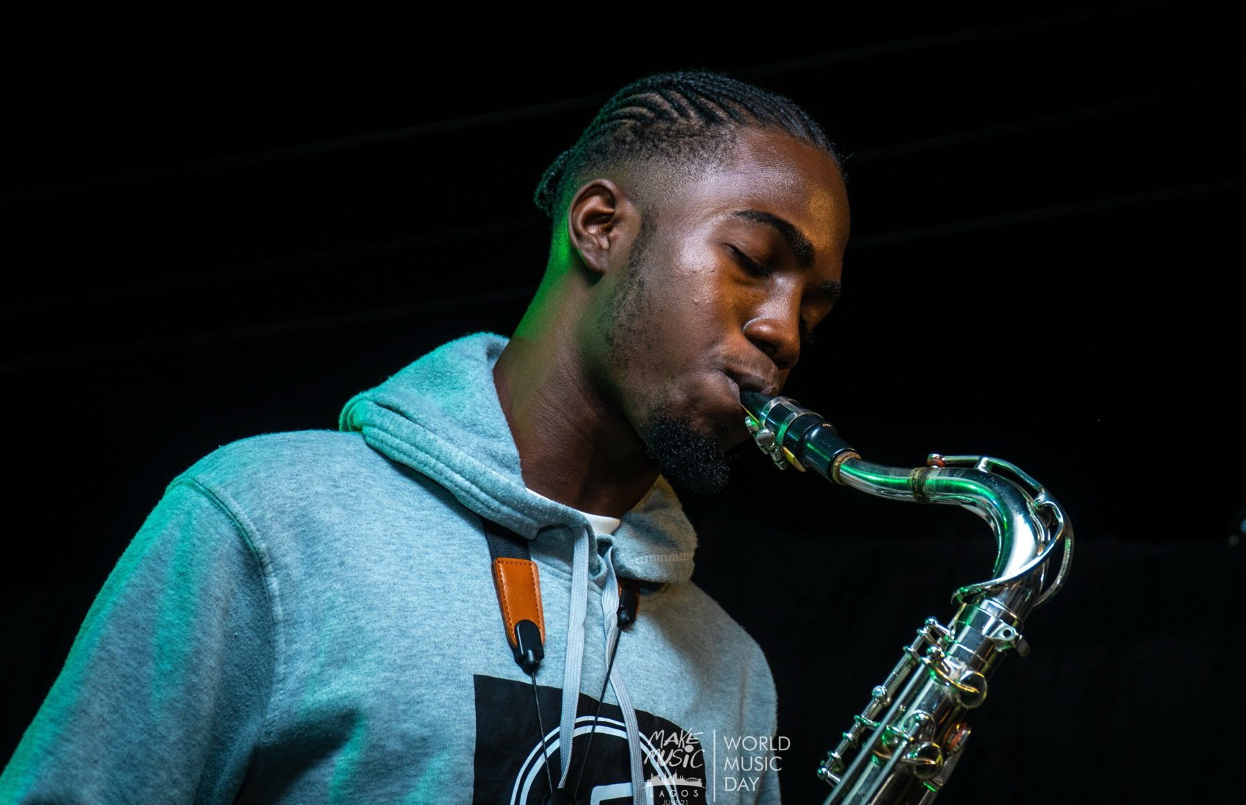 Saxophonist performing at a Make Music Lagos event